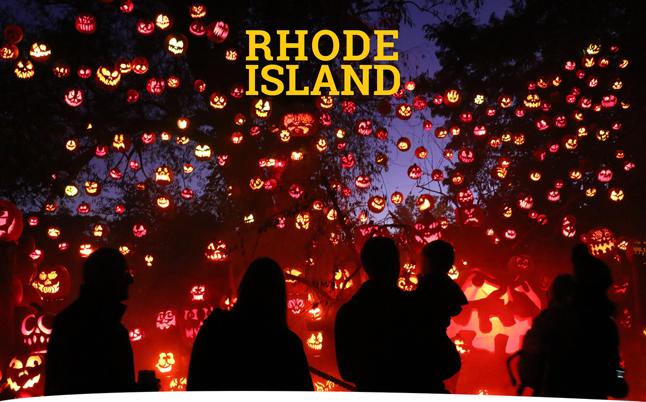 Rhode Island night cityscape with lighted buildings.